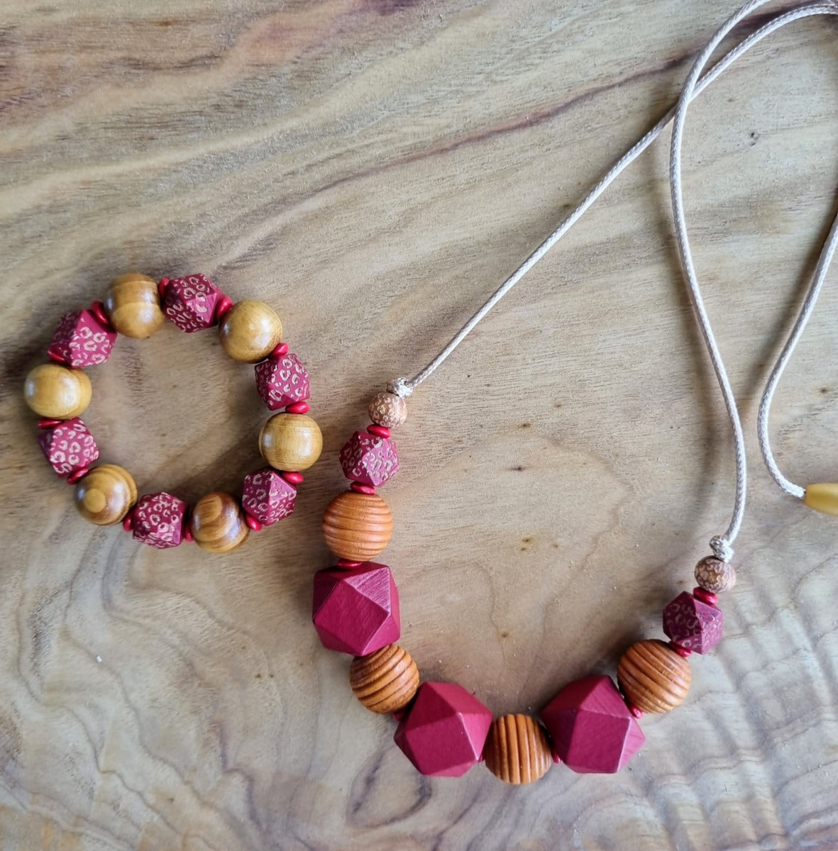 Necklaces- wooden beads on synthetic rope.