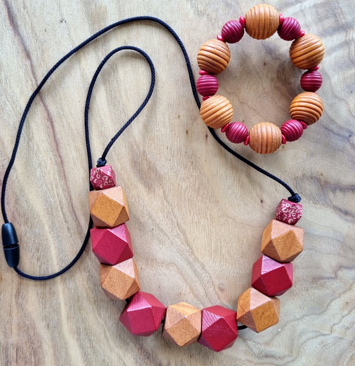 Necklaces- wooden beads on synthetic rope.