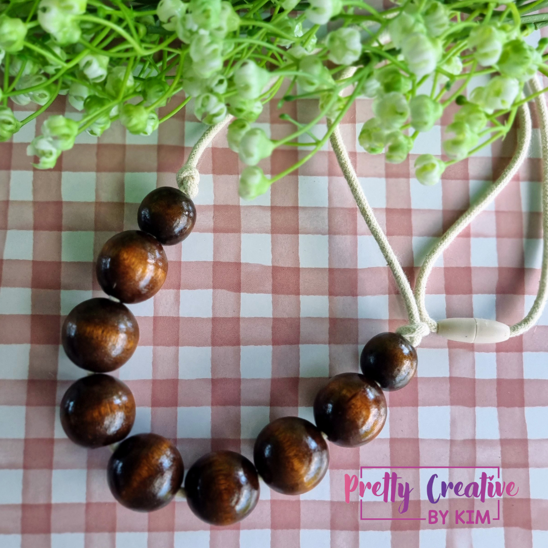 Necklaces- wood beads on cotton rope.