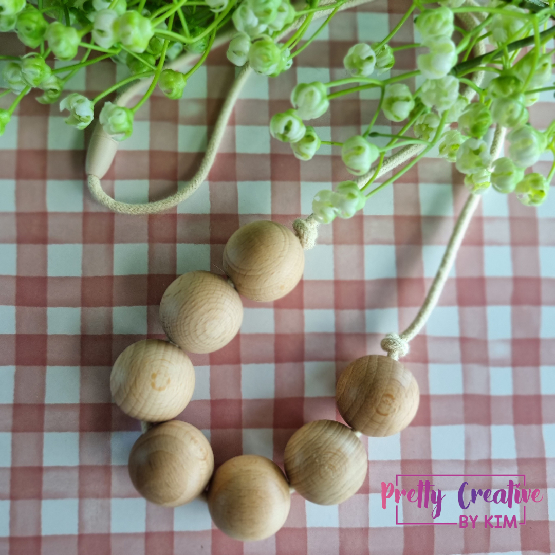 Necklaces- wood beads on cotton rope.