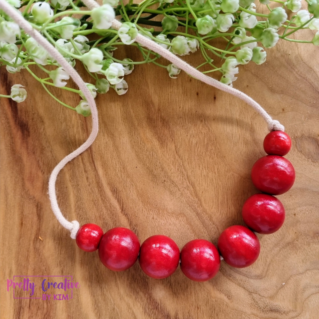 Necklaces- wood beads on cotton rope.