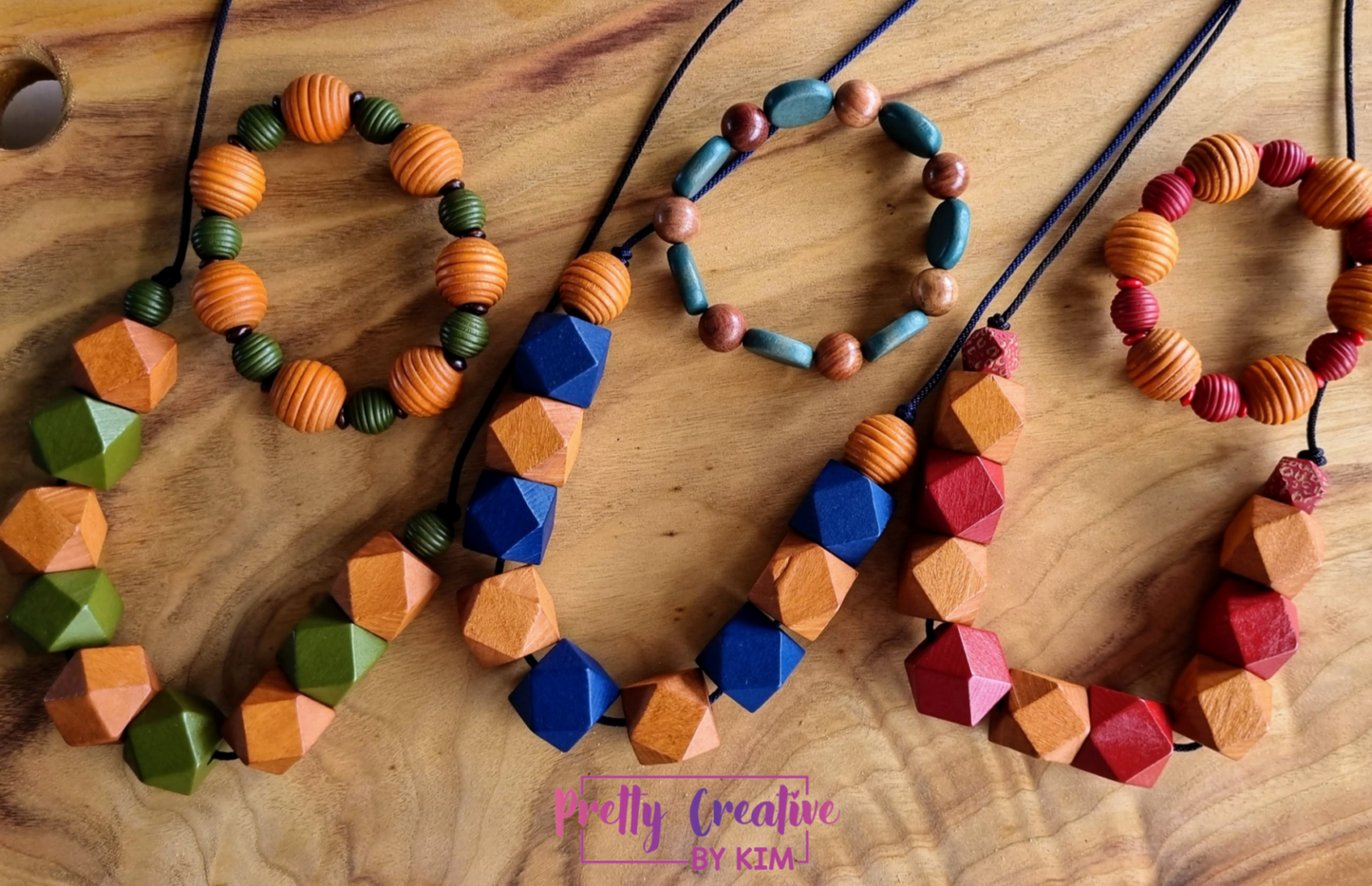 Necklaces- wooden beads on synthetic rope.